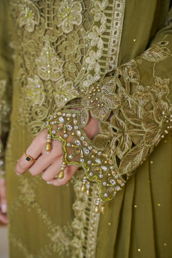 The sleeves of mehndi embroidered dress with pearls on it.